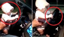 Con vài tháng tuổi ngồi trên đùi bố lái xe ô tô, mẹ ngồi bên quay clip gây tranh cãi