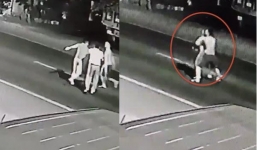 Gã trai mất nhân tính ôm chặt bạn gái lao ra giữa đường để xe ô tô cán