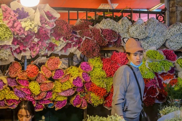Thị trường hoa hoạt động sôi nổi ở chợ Quảng An trước ngày 8/3. Ảnh TPO Thị trường hoa hoạt động sôi nổi ở chợ Quảng An trước ngày 8/3. Ảnh TPO
