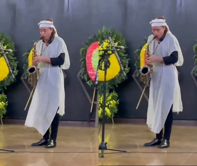 Trước khi đưa linh cữu mẹ về nơi an nghỉ cuối cùng, ông xã Việt Hương đã thổi kèn tặng mẹ khiến nhiều người xúc động. Ảnh cắt clip