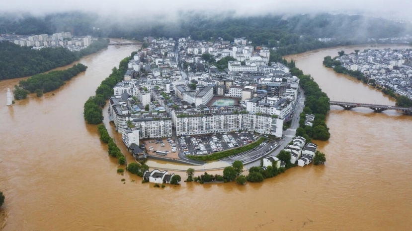 Bức ảnh này được chụp ngày 20/6/2022 cho thấy các đường phố và tòa nhà bị ngập lụt sau trận mưa lớn ở Vụ Nguyên, thuộc tỉnh Giang Tây, miền trung Trung Quốc. Ảnh: CNS Bức ảnh này được chụp ngày 20/6/2022 cho thấy các đường phố và tòa nhà bị ngập lụt sau trận mưa lớn ở Vụ Nguyên, thuộc tỉnh Giang Tây, miền trung Trung Quốc. Ảnh: CNS