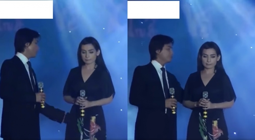 Mạnh Quỳnh phát hiện ra sự cố trang phục và lấy tay kéo Phi Nhung vào người để khắc phục... Mạnh Quỳnh phát hiện ra sự cố trang phục và lấy tay kéo Phi Nhung vào người để khắc phục...